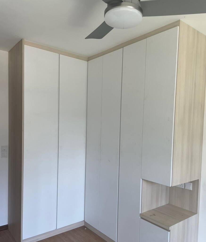 Master bedroom with full-height floor-to-ceiling built-in wardrobe and ambient back-lit headboard